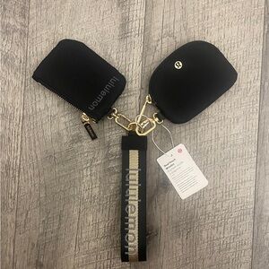 Lululemon Dual Pouch Wristlet
Wordmark Black and Gold Keychain Set